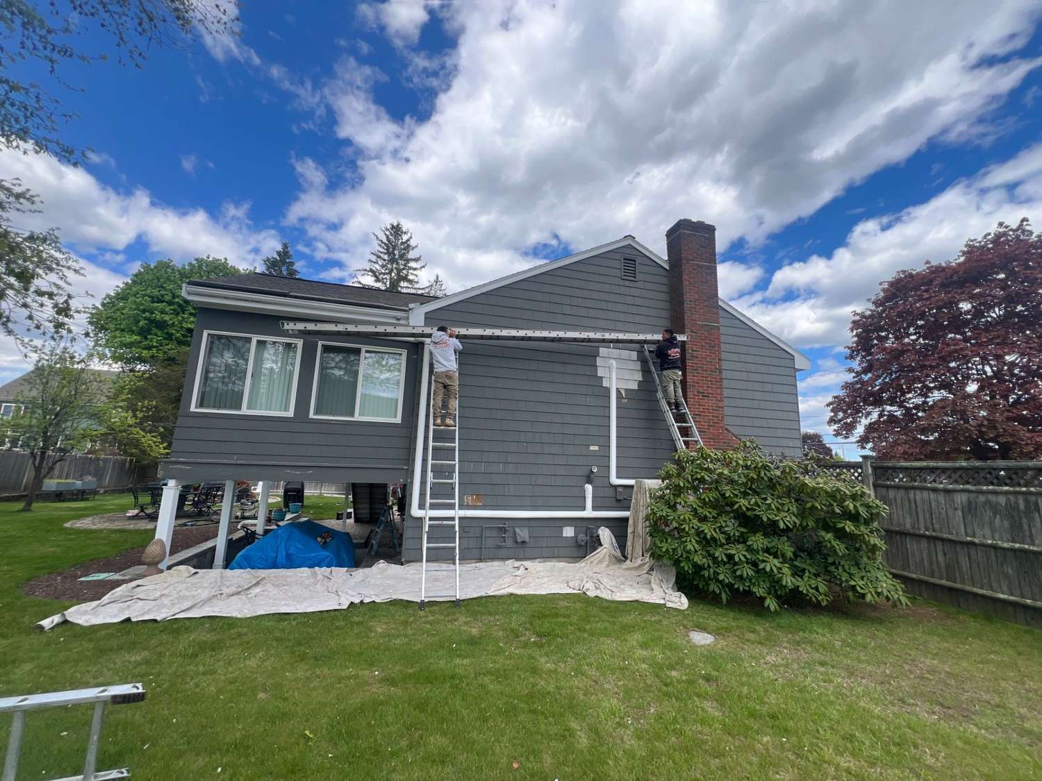 House painters in Peabody, MA painting a home exterior