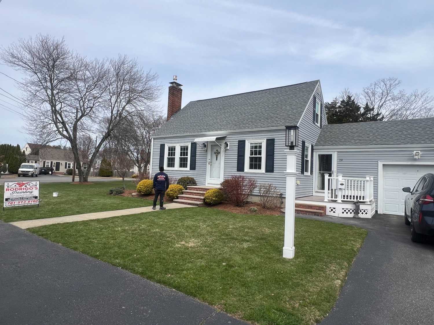 House painters in Swampscott, MA painting a home exterior