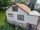 Exterior paint colors for white siding with contrasting brown trim on a residential home